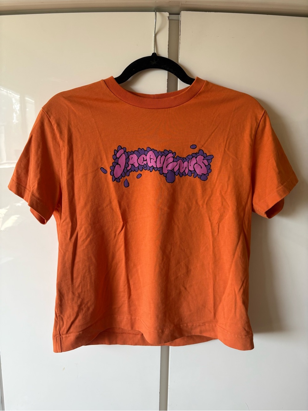 Jacquemus Orange Tee with Purple Logo Graphic